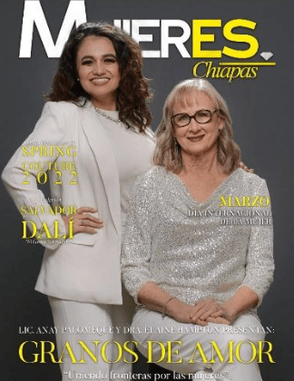 Two women pose on a magazine cover with white and yellow text against a dark gray background.